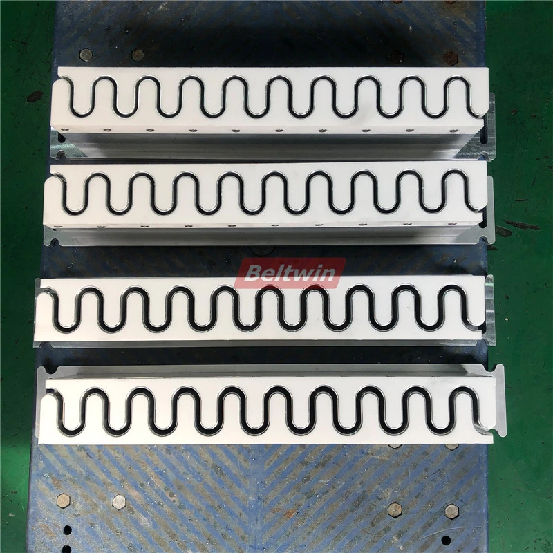 Moldes de guías, paredes laterales y perfiles para bandas transportadoras para soldadura de banda de alta frecuencia